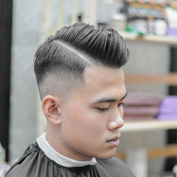 The undercut hairstyle emphasizes the healthy lines of the face